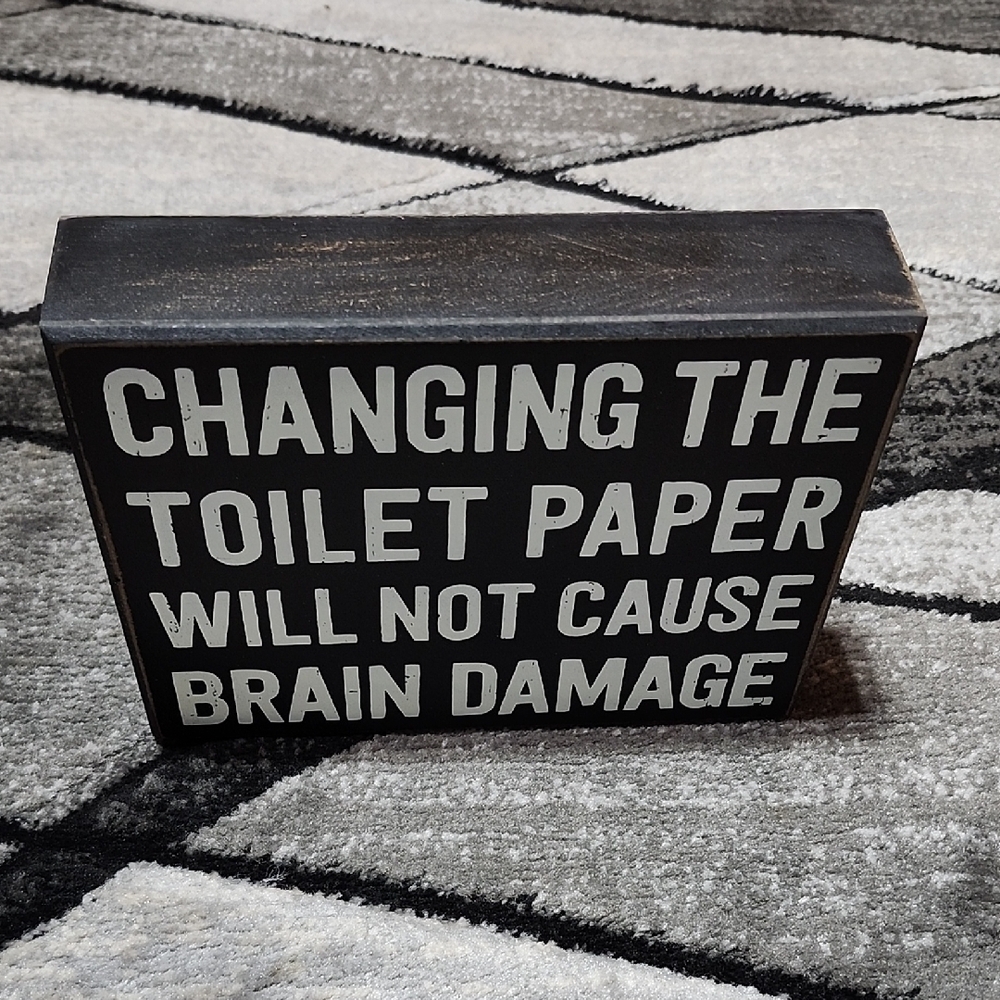 "CHANGING THE TOILET PAPER WILL NOT CAUSE BRAIN DAMAGE" WOODEN SIGN